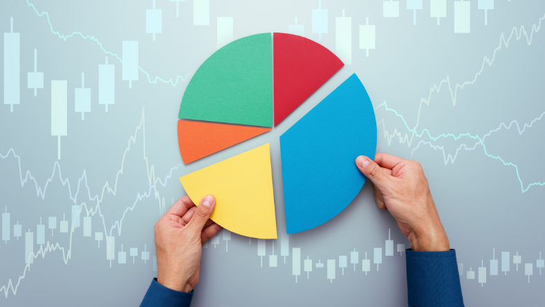 Hands holding up a pie chart diagram