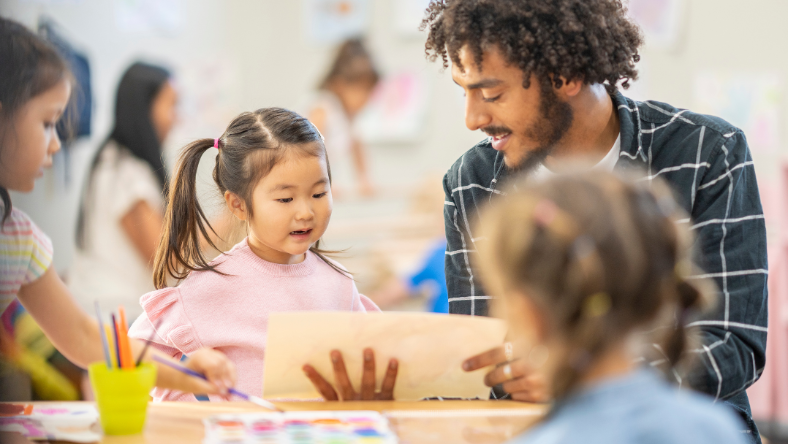 Pre-school teacher with children.