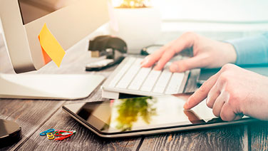 hands on keyboard and tablet