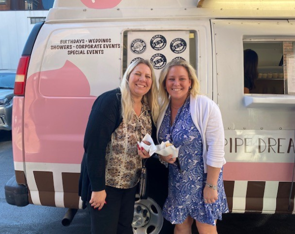 Two Salem Five employees enjoying pipe dreams cupcakes