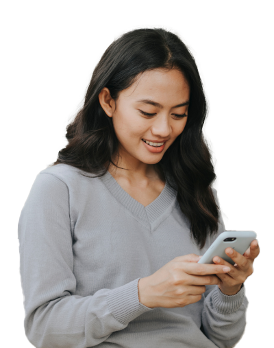 Male wearing brown sweater, holding mobile phone and smiling.